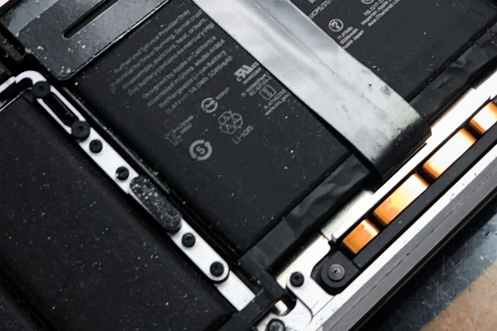 Inside of a laptop with its battery and components exposed